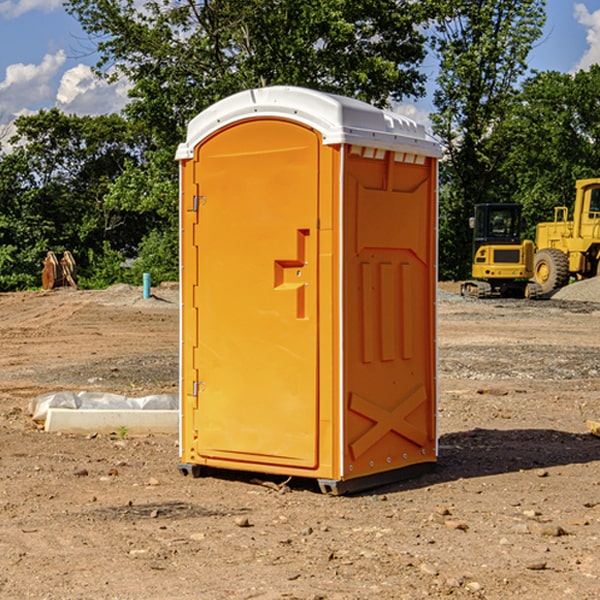 how often are the portable restrooms cleaned and serviced during a rental period in Macon County